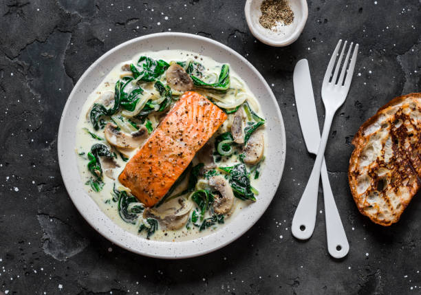 Baked salmon with creamy spinach mushrooms sauce
